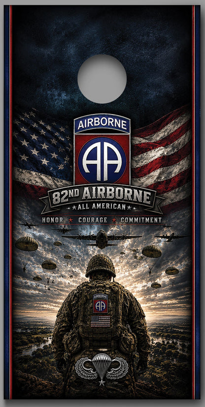 Two matching cornhole board designs shown side by side on a gray background. Each board features a military-themed graphic with an American flag, the text 'Airborne 82nd All American,' parachutist silhouettes, and a soldier seen from behind under a stormy sky.
