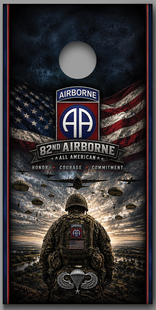Two matching cornhole board designs shown side by side on a gray background. Each board features a military-themed graphic with an American flag, the text 'Airborne 82nd All American,' parachutist silhouettes, and a soldier seen from behind under a stormy sky.