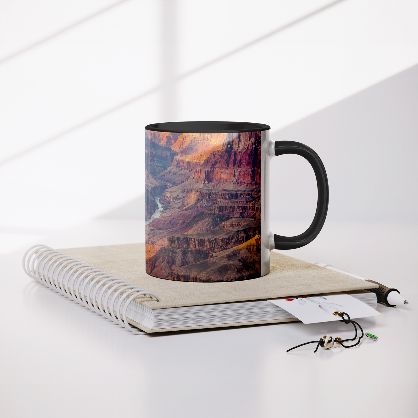 Grand_Canyon_full_wrap_11_oz_coffee_mug_Mug_Lifestyle_Notebook_Mockup.png_15700355