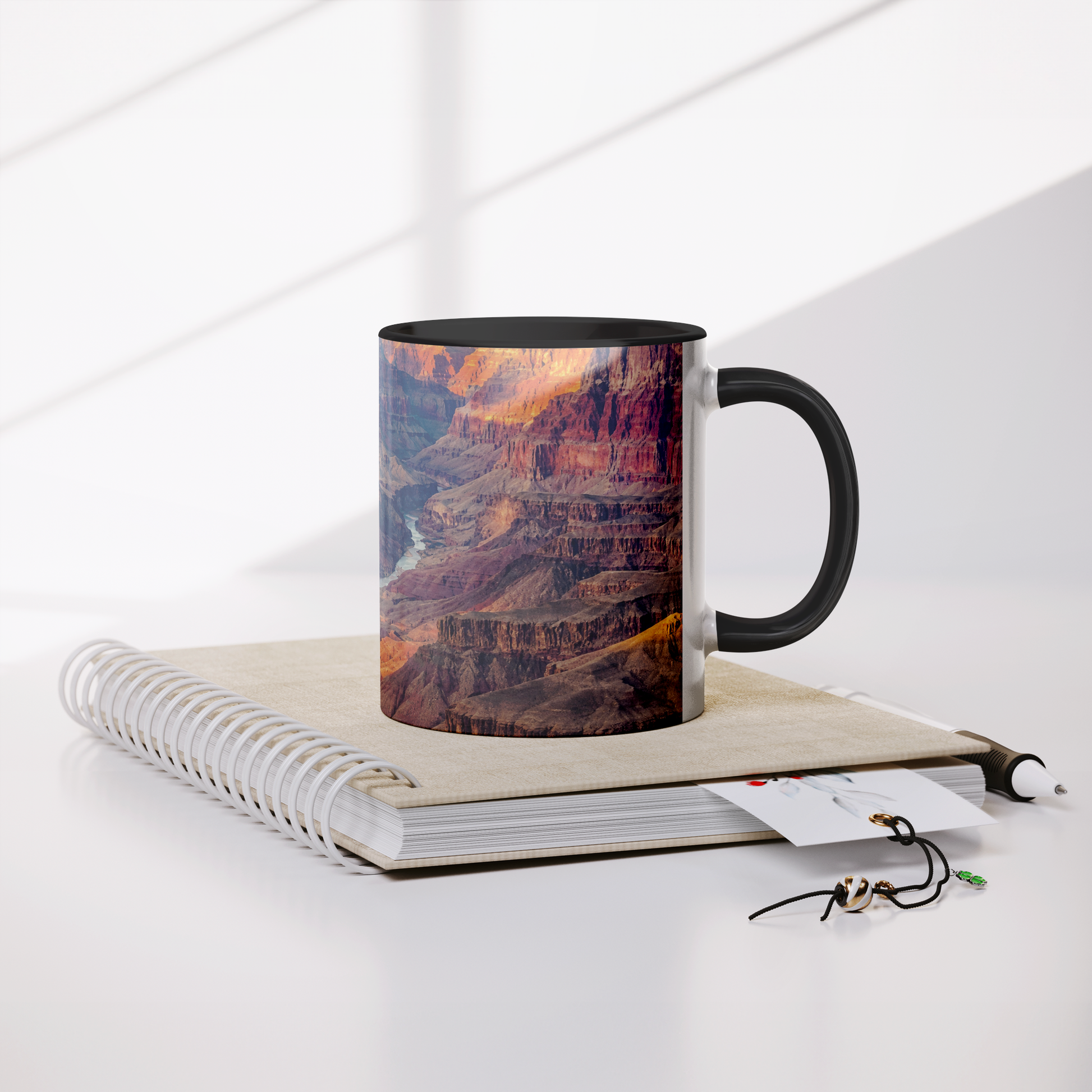 Grand_Canyon_full_wrap_11_oz_coffee_mug_Mug_Lifestyle_Notebook_Mockup.png_15700355