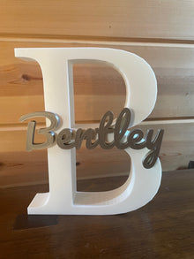 Large first initial and name printed on top