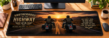 Brotherhood of the Highway Desk Mat in use on a warm wood office desk — overhead workspace view