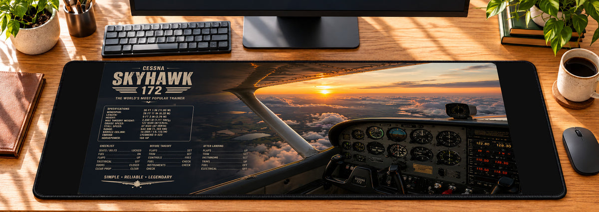 Cessna Skyhawk Cockpit Desk Mat in use on a warm wood office desk — overhead workspace view