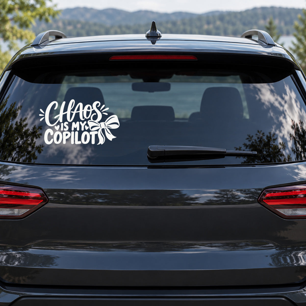 Chaos Is My Copilot Car Window Decal shown on a vehicle window