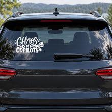 Chaos Is My Copilot Car Window Decal shown on a vehicle window