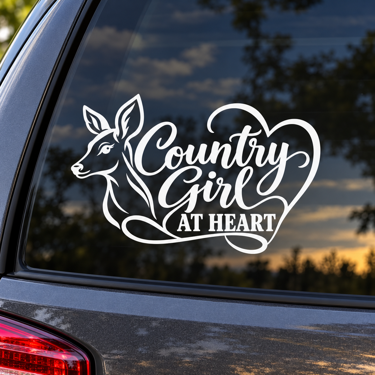 White Country Girl at Heart doe and heart decal on tinted vehicle window