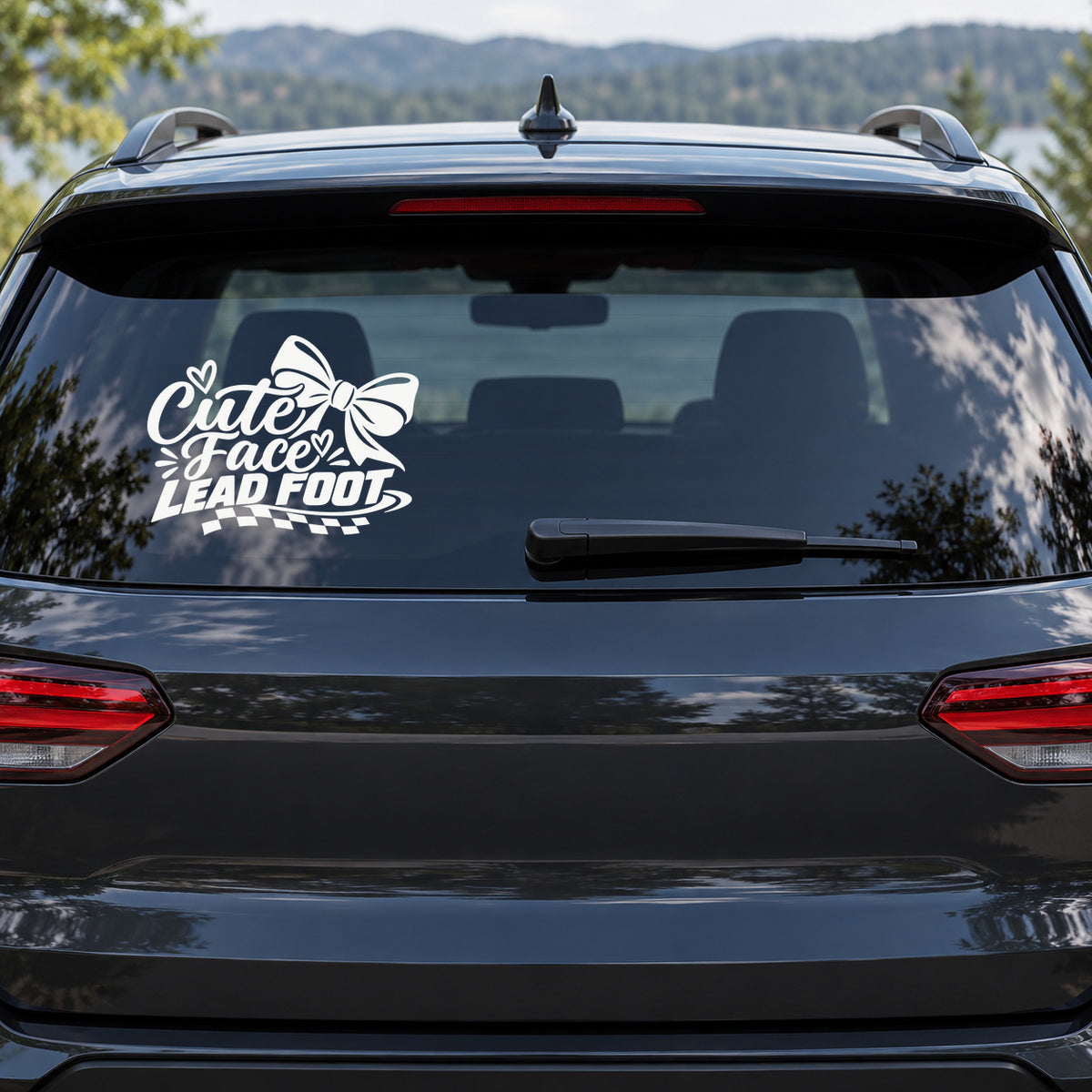 Cute Face Lead Foot Car Window Decal shown on a vehicle window