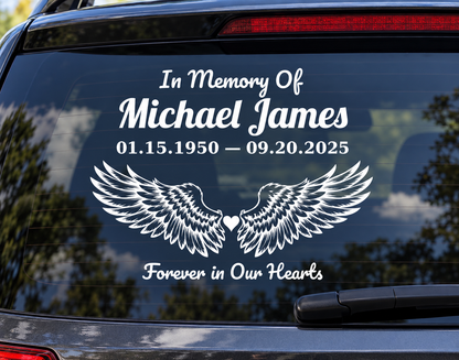 Detailed feathered angel wings memorial decal on a car window, personalized example