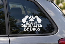 EASILY DISTRACTED BY DOGS contour cut car window decal shown in white