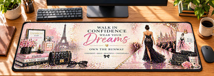 Fashion Runway Confidence Desk Mat in use on a warm wood office desk — overhead workspace view