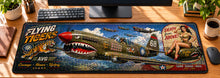 Flying Tiger Sharkmouth Legacy Desk Mat in use on a warm wood office desk — overhead workspace view