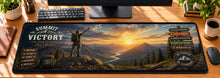 Hiking Summit Victory Desk Mat in use on a warm wood office desk — overhead workspace view