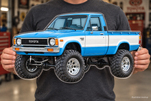 1979 Toyota Hilux Sky Blue and White acrylic truck sign held mockup