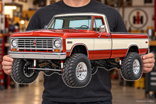 1973 International Harvester 1210 4x4 contour-cut clear acrylic sign held in hands, illustrative mockup