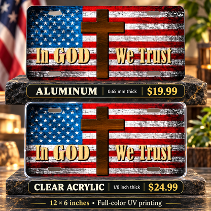 In God We Trust American Flag Cross License Plate Car Tag — aluminum $19.99 and ⅛-inch clear acrylic $24.99 material comparison