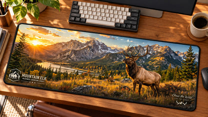 Mountain Elk Wilderness Desk Mat in use on a warm wood office desk — angled workspace view