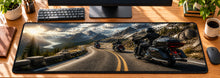 Mountain Pass Thunder Desk Mat in use on a warm wood office desk — overhead workspace view