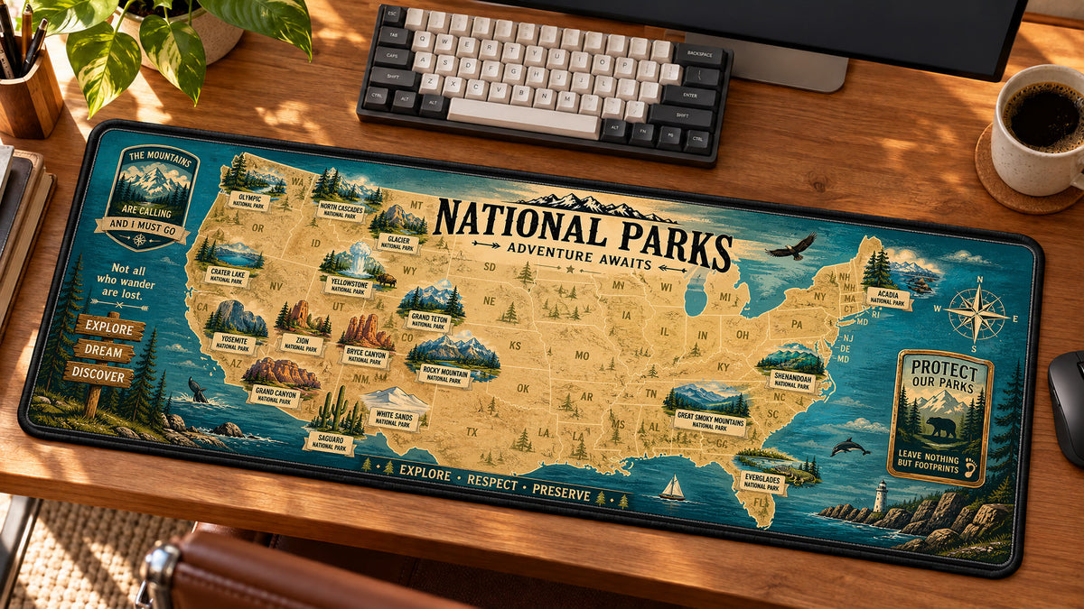 National Park Adventure Map Desk Mat in use on a warm wood office desk — angled workspace view
