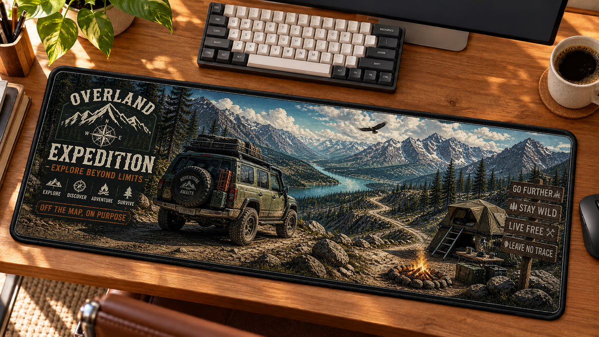 Overland Off-Road Expedition Desk Mat in use on a warm wood office desk — angled workspace view