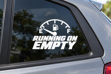 RUNNING ON EMPTY contour cut car window decal shown in white