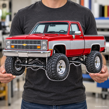 Person holding red and silver 1987 Chevrolet Silverado flat contour-cut acrylic sign, illustrative mockup