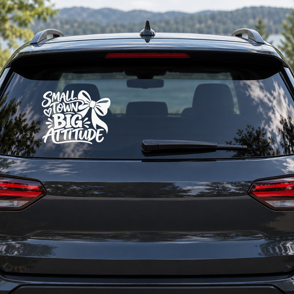 Small Town Big Attitude Car Window Decal shown on a vehicle window