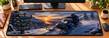 Snowmobile Alpine Rush Desk Mat in use on a warm wood office desk — overhead workspace view