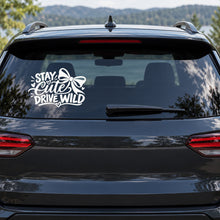 Stay Cute Drive Wild Car Window Decal shown on a vehicle window