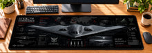 Stealth Bomber Strategic Strike Desk Mat in use on a warm wood office desk — overhead workspace view