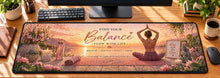 Sunrise Yoga Harmony Desk Mat in use on a warm wood office desk — overhead workspace view