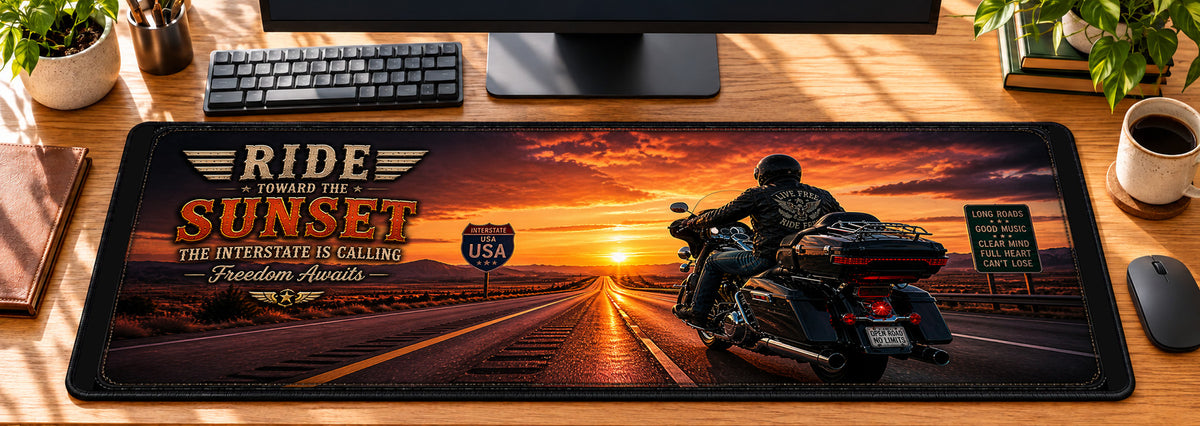 Sunset Interstate Cruiser Desk Mat in use on a warm wood office desk — overhead workspace view