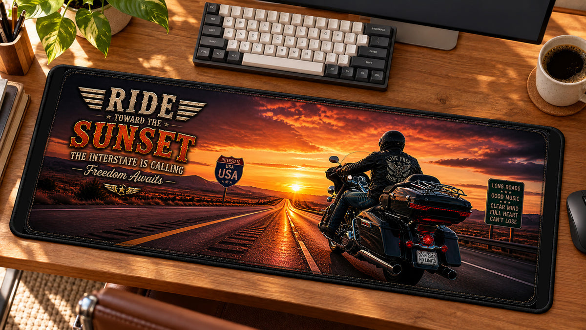Sunset Interstate Cruiser Desk Mat in use on a warm wood office desk — angled workspace view
