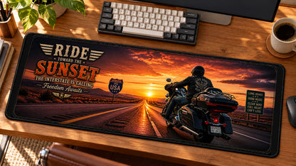 Sunset Interstate Cruiser Desk Mat in use on a warm wood office desk — angled workspace view