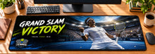 Tennis Grand Slam Victory Desk Mat in use on a warm wood office desk — overhead workspace view