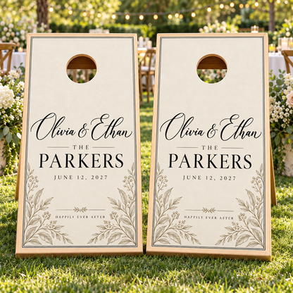 Modern Ivory Personalized Wedding Cornhole Board Wraps on two boards at a garden reception; boards not included
