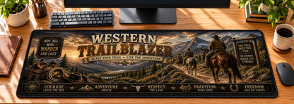 Western Trailblazer Desk Mat in use on a warm wood office desk — overhead workspace view