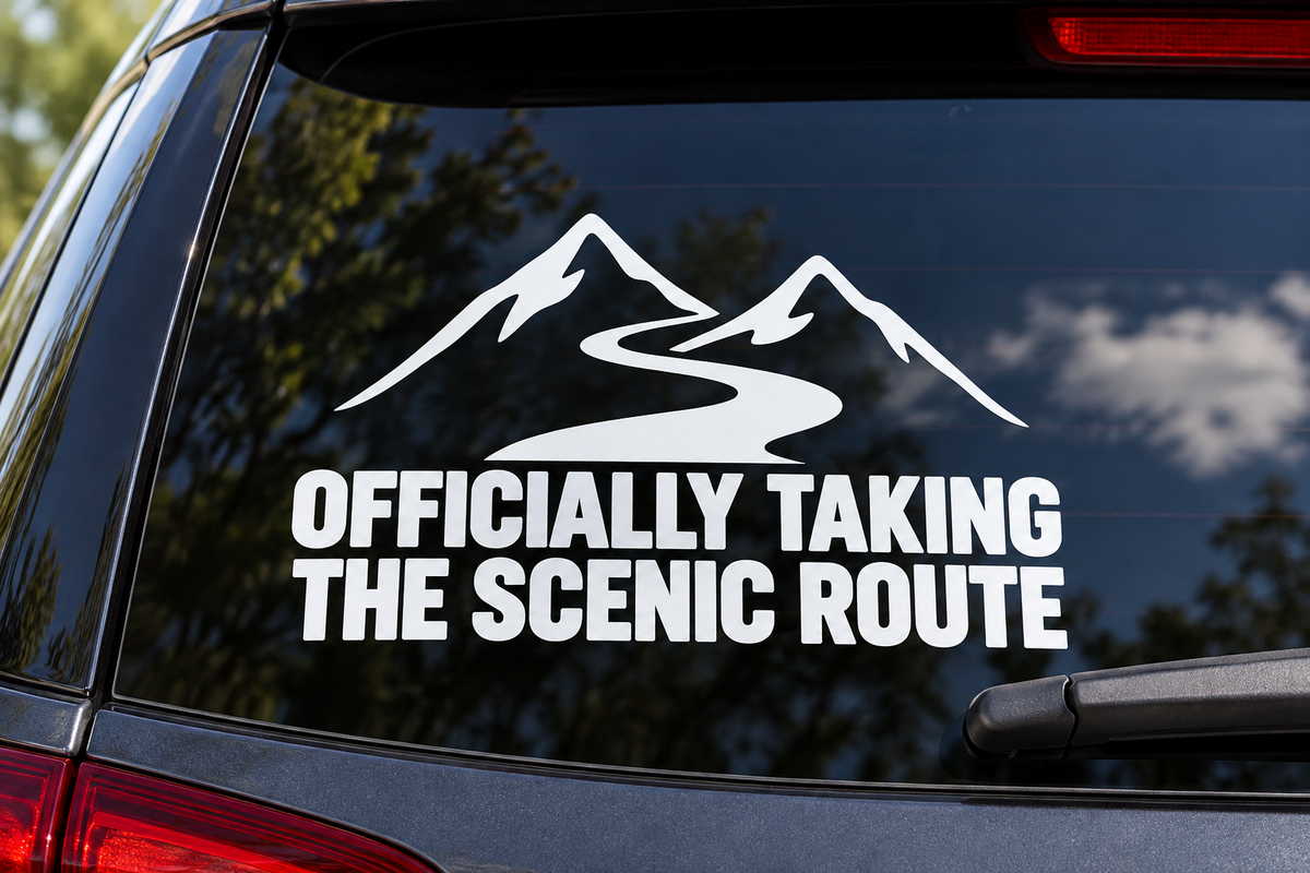Officially Taking the Scenic Route Car Window Decal shown on a car window