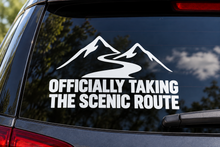 Officially Taking the Scenic Route Car Window Decal shown on a car window