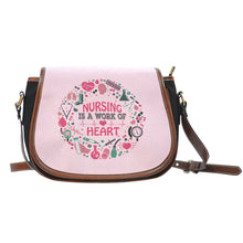 NURSING IS A WORK OF HEART SADDLE BAG
