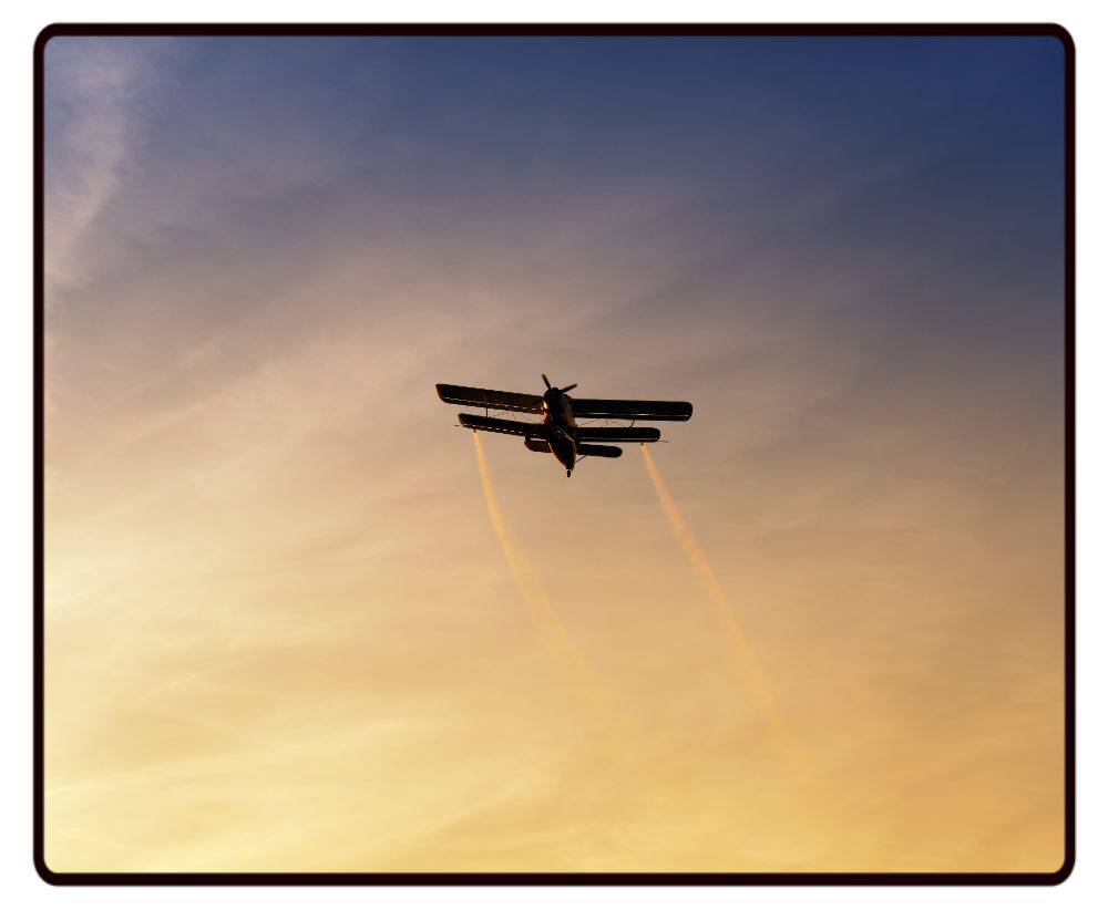 Biplane Sunset Desk Mat