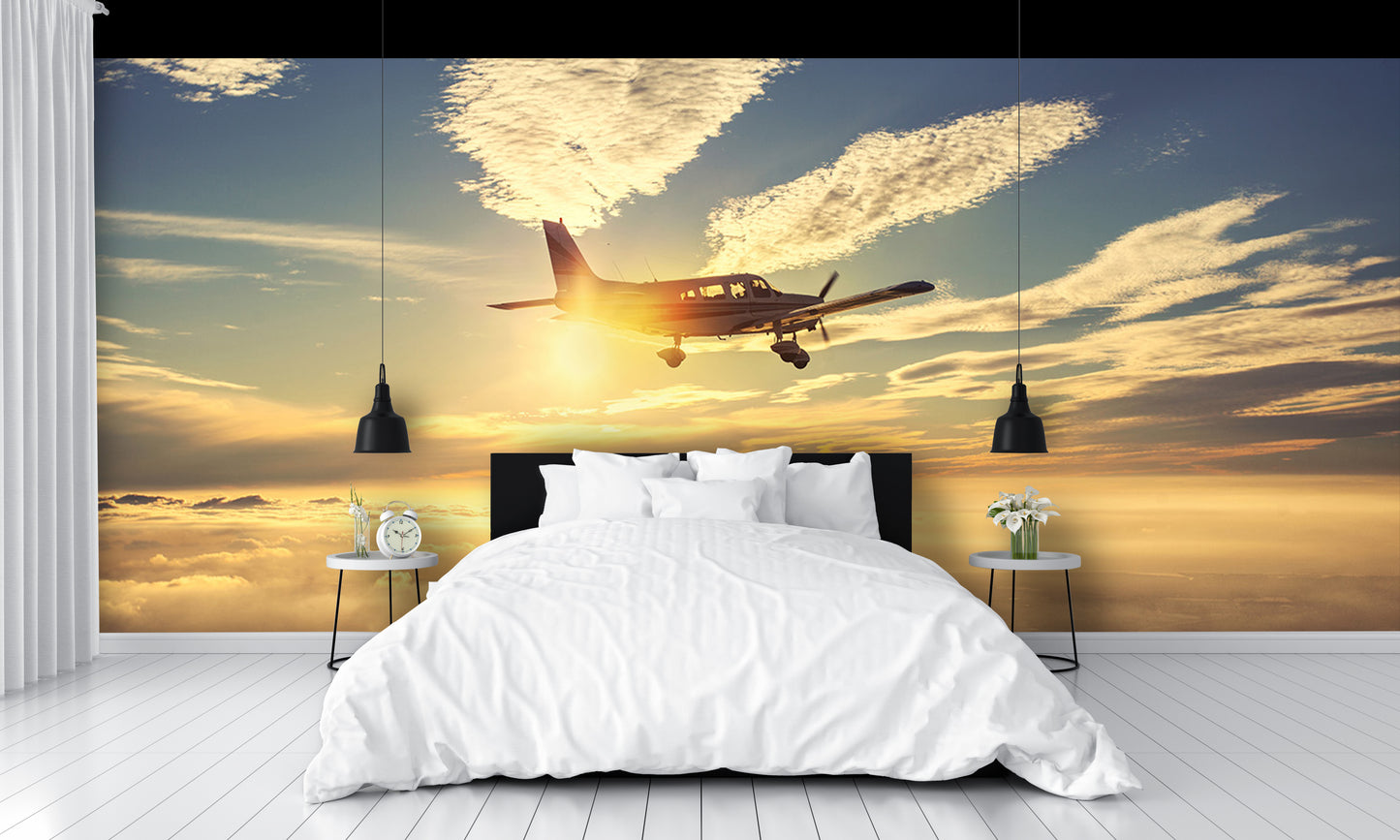 Small Airplane Flying at Sunset Clouds Wall Mural
