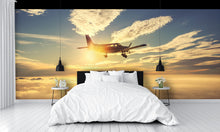 Small Airplane Flying at Sunset Clouds Wall Mural