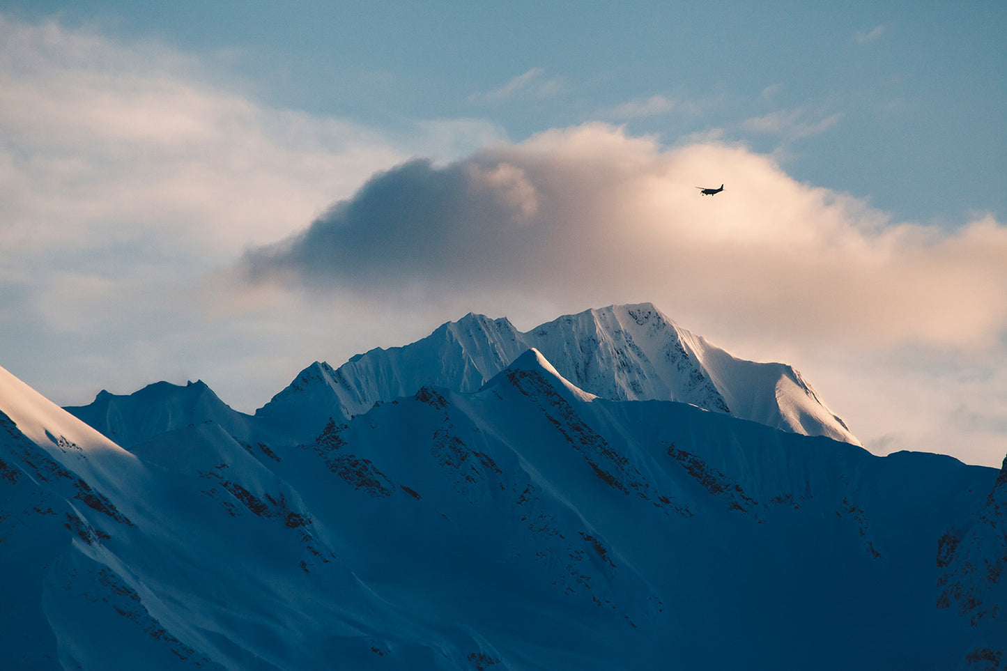 Bush Plane Flies Over Alaska Mountains Wall Mural
