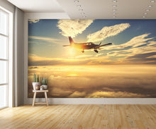 Small Airplane Flying at Sunset Clouds Wall Mural