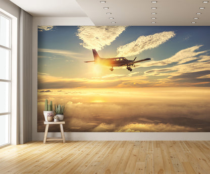 Small Airplane Flying at Sunset Clouds Wall Mural