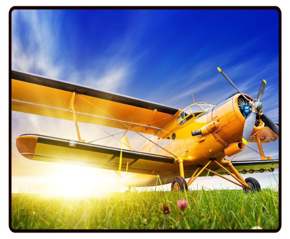 Yellow Biplane Sunset Desk Mat