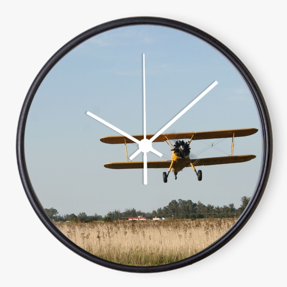 Stearman Biplane Over a Field 10 inch wall clock